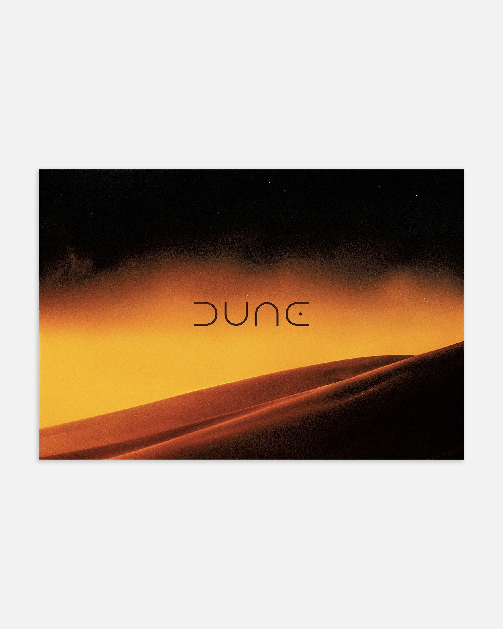 Dune movie poster with sand dunes and sunset