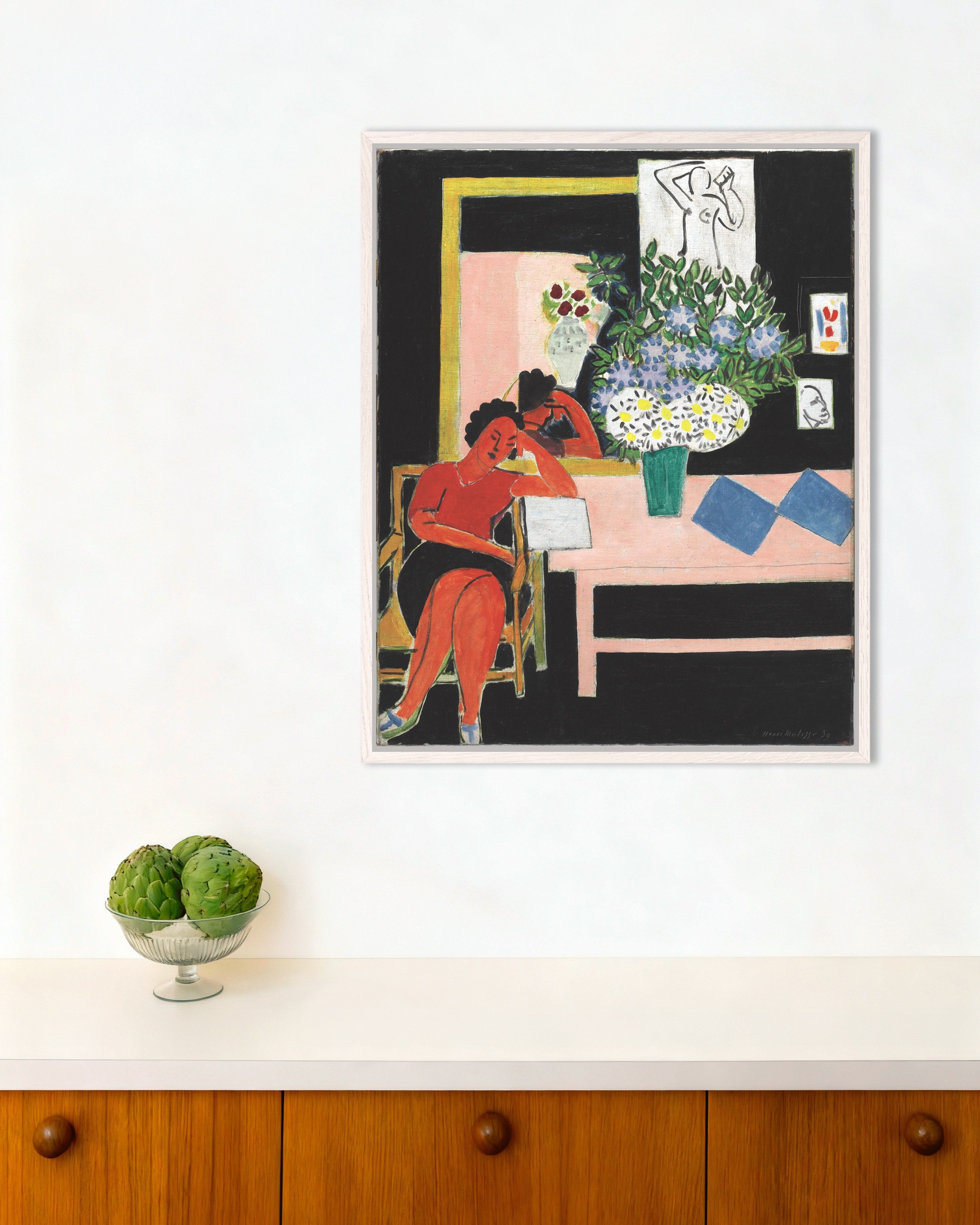 Poster of Reader on a Black Background (Liseuse sur fond noir) by Henri Matisse, with white wooden frame